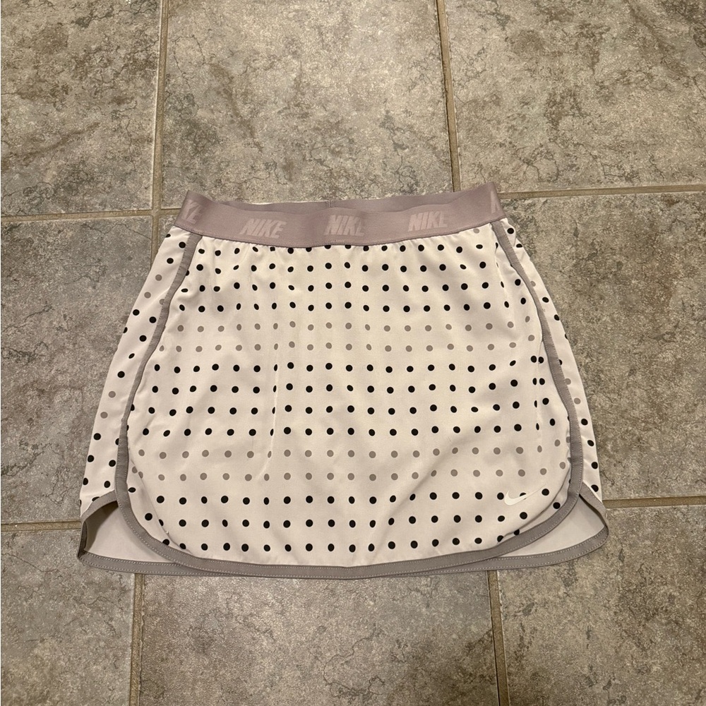 Classic Nike White Polka Dot Tennis Skort with Light Gray Waistband.